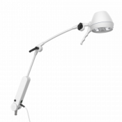 Lampe d'examen avec bras à double articulation et ressort de soutien